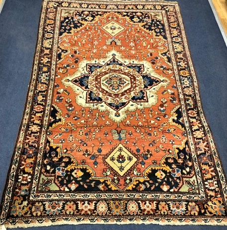 A Persian rug 208 x 129cm